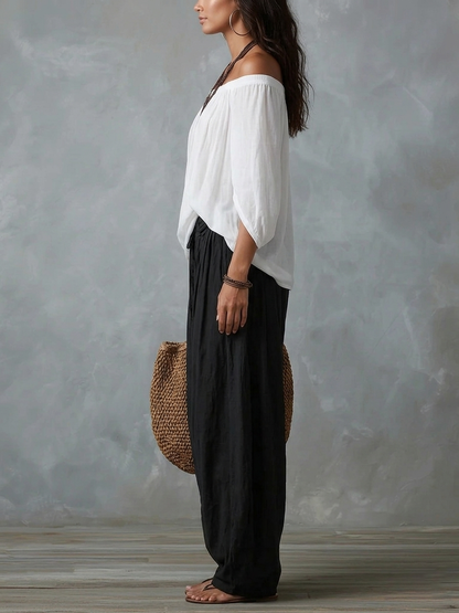 Set Top Bianco Off-Shoulder e Pantaloni Larghi